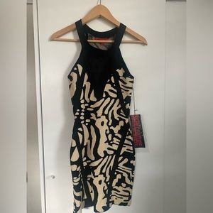 Size small. Tan and black dress